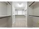Spacious walk-in closet featuring shelving and hanging racks at 1560 Heritage Trl, Roswell, GA 30075
