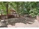 Expansive wooden deck offers a serene outdoor space with views of the surrounding greenery at 3657 Linda Dr, Loganville, GA 30052