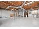 Spacious basement with exposed ceiling, cement floor, and access to utilities, offering potential for customization at 3657 Linda Dr, Loganville, GA 30052
