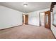 Bedroom with neutral carpet, closet, and lighting at 3657 Linda Dr, Loganville, GA 30052