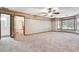 Large bonus room with a ceiling fan and multiple windows at 3657 Linda Dr, Loganville, GA 30052