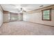 Spacious bonus room with plush carpeting, ceiling fan and natural light at 3657 Linda Dr, Loganville, GA 30052