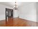 Bright dining room with hardwood floors and elegant chandelier at 3657 Linda Dr, Loganville, GA 30052