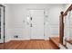 Entry way featuring wood flooring, white walls, and a white front door at 3657 Linda Dr, Loganville, GA 30052