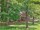 Secluded house surrounded by lush trees and greenery, offering a serene and private living environment at 3657 Linda Dr, Loganville, GA 30052
