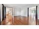 Open concept living room with hardwood floors leading to entryway at 3657 Linda Dr, Loganville, GA 30052