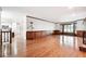 Spacious living room with wood paneling, fireplace, and large windows at 3657 Linda Dr, Loganville, GA 30052