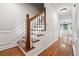 Staircase with wood steps and white wainscotting along the wall at 3657 Linda Dr, Loganville, GA 30052