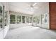 Bright sun room with vaulted ceiling, windows, and scenic backyard views at 3657 Linda Dr, Loganville, GA 30052