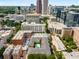 Breathtaking aerial view of the complex and surrounding city skyline, lush greenery, and sparkling pool at 800 Peachtree Ne St # 8612, Atlanta, GA 30308
