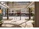 Modern building exterior with an open outdoor area for pedestrian access at 800 Peachtree Ne St # 8612, Atlanta, GA 30308