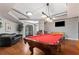 Community game room with billiards, foosball table, a TV, and comfy seating, perfect for relaxing with friends at 800 Peachtree Ne St # 8612, Atlanta, GA 30308