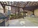 Outdoor grilling area featuring stainless steel grills, a pergola, and outdoor seating, perfect for entertaining at 800 Peachtree Ne St # 8612, Atlanta, GA 30308