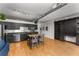 Kitchen features stainless steel appliances, black cabinetry, kitchen island and hardwood floors at 800 Peachtree Ne St # 8612, Atlanta, GA 30308