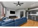Inviting living area with exposed brick, a ceiling fan, and stainless steel kitchen appliances at 800 Peachtree Ne St # 8612, Atlanta, GA 30308