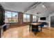 Open living area featuring exposed brick walls and large windows, providing an abundance of natural light at 800 Peachtree Ne St # 8612, Atlanta, GA 30308