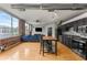 Open-concept living area showcases exposed brick, stainless steel appliances, and a modern kitchen island at 800 Peachtree Ne St # 8612, Atlanta, GA 30308