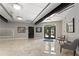 Open lobby area with neutral colors, modern lighting, tiled floors and lounge seating at 800 Peachtree Ne St # 8612, Atlanta, GA 30308