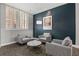 Cozy lounge area with comfortable seating, stylish decor, and natural light from the window at 800 Peachtree Ne St # 8612, Atlanta, GA 30308