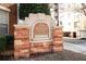 Cornerstone Village sign featuring brick columns, historic lofts, and condominium information at 800 Peachtree Ne St # 8612, Atlanta, GA 30308