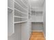 Organized walk-in closet with built-in shelving and drawers for ample storage at 800 Peachtree Ne St # 8612, Atlanta, GA 30308
