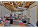 Unfinished basement with exposed ceiling, painted concrete walls, and multicolored floor at 323 Bells Ferry Ne Rd, White, GA 30184
