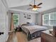Serene bedroom with vaulted ceiling, wood floors, and a ceiling fan at 323 Bells Ferry Ne Rd, White, GA 30184