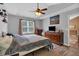 Cozy bedroom with vaulted ceiling, ceiling fan, and ample closet space at 323 Bells Ferry Ne Rd, White, GA 30184