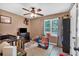 Comfortable bedroom with ceiling fan, natural light, and cozy decor at 323 Bells Ferry Ne Rd, White, GA 30184