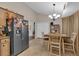Bright dining area open to kitchen, featuring tile floors and natural light at 323 Bells Ferry Ne Rd, White, GA 30184