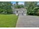 Charming two-story home with a two car garage and nicely manicured lawn at 323 Bells Ferry Ne Rd, White, GA 30184