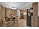 Bright eat-in kitchen featuring stainless appliances, tile floors, and updated fixtures at 323 Bells Ferry Ne Rd, White, GA 30184