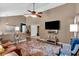 Comfortable living room featuring hardwood floors, vaulted ceiling and TV at 323 Bells Ferry Ne Rd, White, GA 30184
