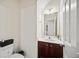 Bright half bath features a modern vanity, fixtures, and neutral decor at 1278 Houndslake Dr, Marietta, GA 30008