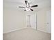 Bedroom with a ceiling fan, neutral carpet, and closet with a view into the hallway at 1278 Houndslake Dr, Marietta, GA 30008