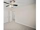 Bedroom with a ceiling fan, neutral carpet, and closet with a view into the hallway at 1278 Houndslake Dr, Marietta, GA 30008