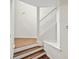 Inviting entryway showcases a staircase with wood and white accents and gleaming hardwood floors at 1278 Houndslake Dr, Marietta, GA 30008