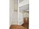 Bright entryway features a staircase with white railing and hardwood floors leading to living spaces at 1278 Houndslake Dr, Marietta, GA 30008
