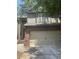 Two-story townhome with attached garage and brick and siding facade, including concrete driveway at 1278 Houndslake Dr, Marietta, GA 30008
