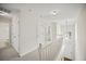 Bright upstairs hallway with neutral decor, and view to entry at 1278 Houndslake Dr, Marietta, GA 30008