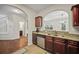Open kitchen with granite counters and stainless appliances flowing into hardwood-floored living area at 1278 Houndslake Dr, Marietta, GA 30008