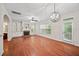 Cozy living room boasts hardwood floors, fireplace, built-ins, and modern lighting fixtures at 1278 Houndslake Dr, Marietta, GA 30008