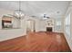 Bright living room with hardwood floors, fireplace, and arched openings to the kitchen and entryway at 1278 Houndslake Dr, Marietta, GA 30008