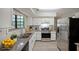 Spacious kitchen with white cabinets, stainless appliances, and granite countertops at 3087 Drexel Ln, Jonesboro, GA 30236