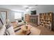 Cozy living room with fireplace, ceiling fan, and neutral decor at 3087 Drexel Ln, Jonesboro, GA 30236