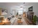 Comfortable living room featuring a fireplace, ceiling fan, and stylish furnishings at 3087 Drexel Ln, Jonesboro, GA 30236