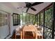 Inviting sunroom with a ceiling fan and a wooden dining table, perfect for relaxation at 3087 Drexel Ln, Jonesboro, GA 30236