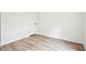 Cozy bedroom featuring modern hardwood floors and minimalist white walls with a closet at 4148 Emerald North Dr, Decatur, GA 30035