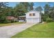 Beautiful two-story home with a long driveway and a well-manicured lawn at 4148 Emerald North Dr, Decatur, GA 30035