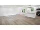 Open-concept living room featuring light wood floors and ample natural light at 4148 Emerald North Dr, Decatur, GA 30035